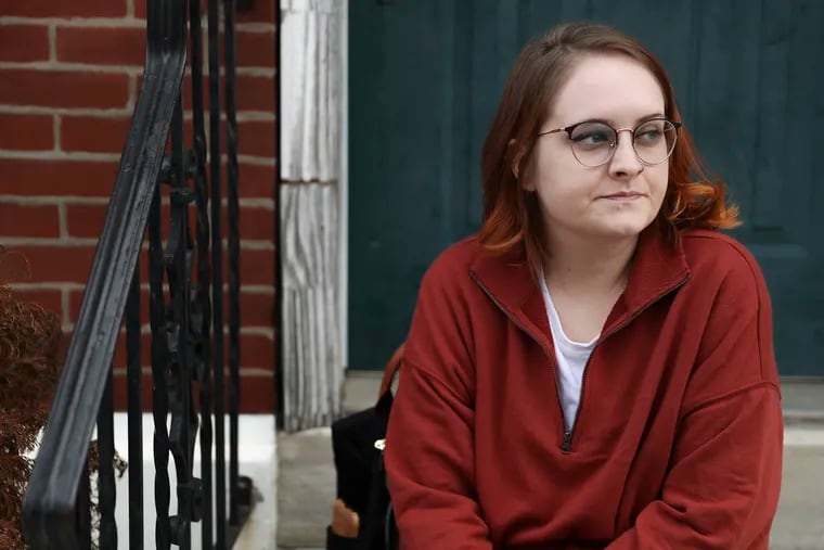 Katelyn Langjahr, 27, poses for a portrait outside of her Port Richmond home in Philadelphia on Friday, Jan. 15, 2021. Langjahr has a number of health conditions, but was told she is not eligible for the next round of vaccinations.