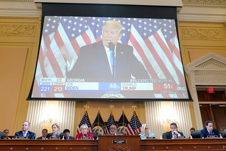 A video exhibit plays as the House select committee investigating the Jan. 6 attack on the U.S. Capitol reveals its findings on Monday.