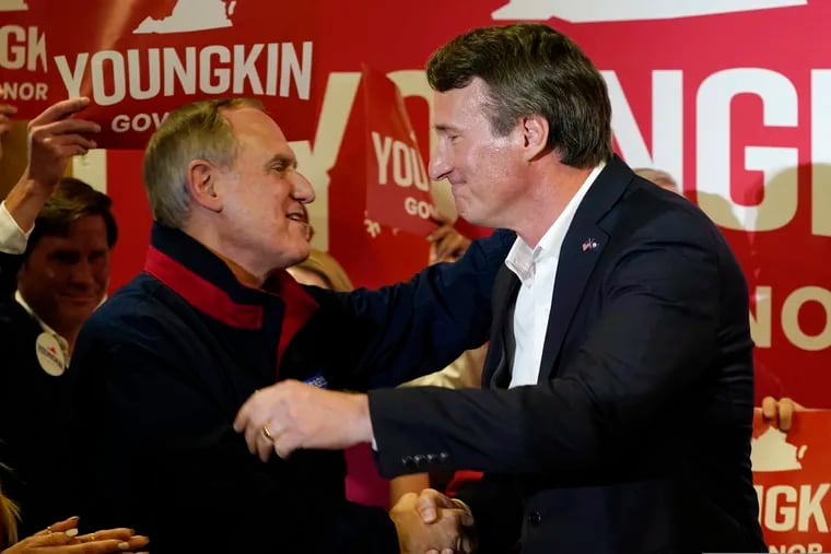 Then-Republican gubernatorial candidate Glenn Youngkin (right) embracing Virginia Republican Party chairman Rich Anderson as he arrived for an event in Richmond, Va., in May 2021.