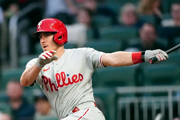 Philadelphia Phillies' J.T. Realmuto drives in a run with a triple in the third inning of a baseball game against the Atlanta Braves, Monday, May 23, 2022, in Atlanta. (AP Photo/John Bazemore)