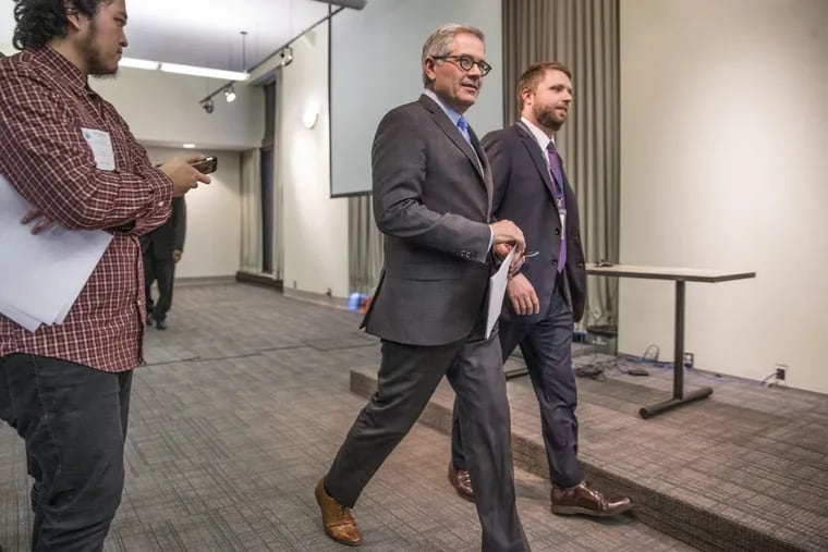 Philadelphia District Attorney Larry Krasner, center, arrives to his press conference to announce an end to cash bail in Philadelphia for low-level offenses on February 21, 2018.