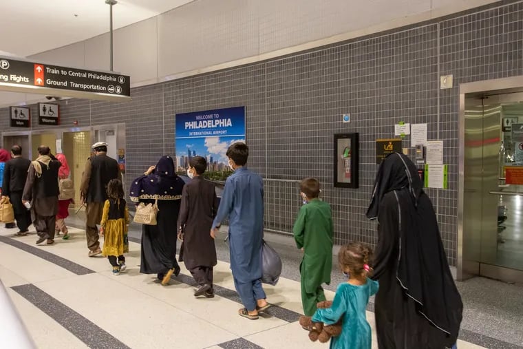 Afghan evacuees arriving at Philadelphia International Airport, where they're being processed and moved on to temporary housing at a military base in South Jersey. Philadelphia is the second U.S. city receiving flights carrying people evacuated from Afghanistan.