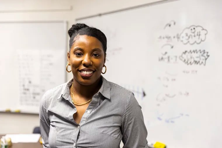 Satoia Wright, 33, of West Philadelphia, Math teacher at Friends Select School, poses for a portrait in her classroom where students are taking an Algebra summer course in Spanish on Thursday, July 29, 2021. “I think it’s essential and I’m happy about the bilingual class,” Wright said. “The students have the exposure and earlier access to algebraic concepts.”