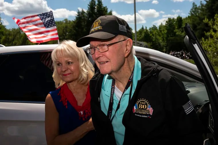 World War II veteran James A. O’Brien, alongside his daughter-in-law Marlene O’Brien, is welcomed home  after attending a D-Day anniversary observance in France.