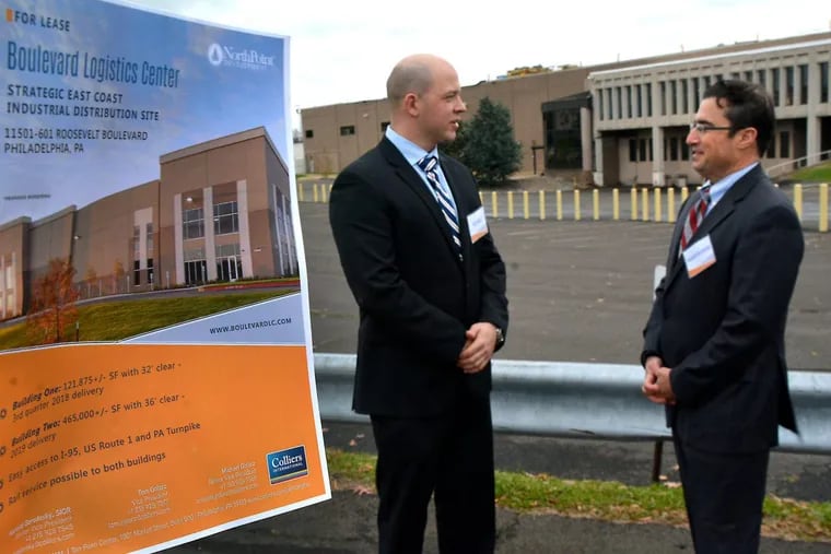 Colliers International brokers (L-R) Tom Golarz,L, and Richard S. Gorodesky outside of the Northeast Philadelphia buildings that are being redeveloped into a new warehouse complex called the Boulevard Logistics Center.