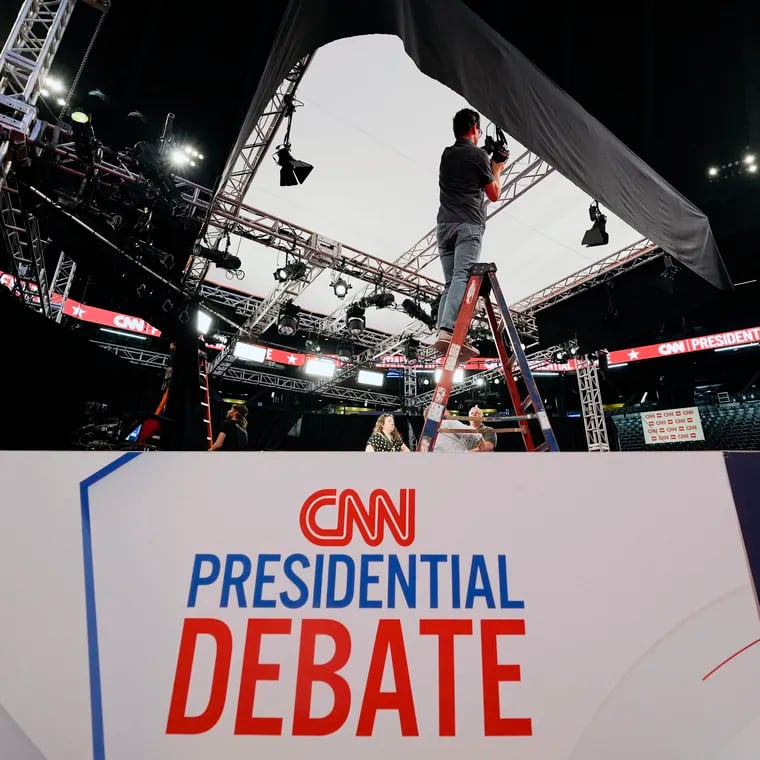 Workers set up lighting for the upcoming CNN presidential debate between President Joe Biden and former president and presumptive Republican nominee Donald Trump in Atlanta.