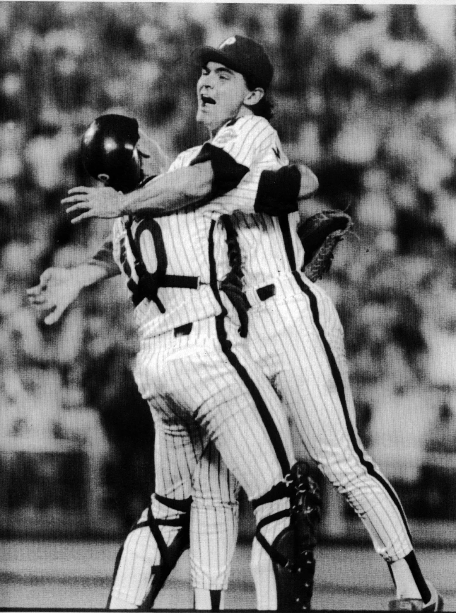 Catcher Darren Daulton (No. 10) hugs Terry Mulholland after the pitcher's 1990 no-hitter at Veterans Stadium. 