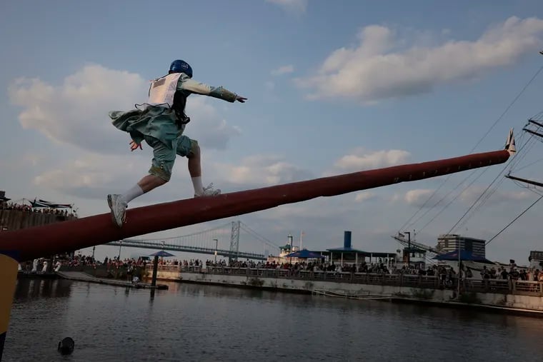 Haddonfield’s Colin Cunningham came dressed as King George but slipped while attempting to run up the greased pole during the Red Bull Championship Run at Spruce Harbor Park on Saturday.