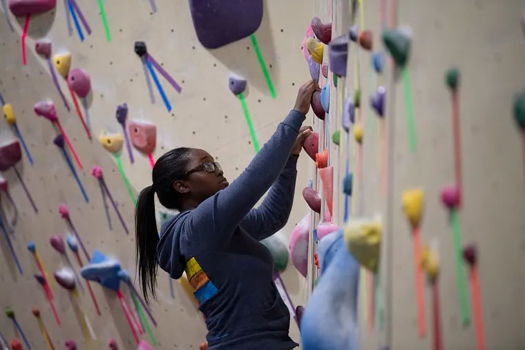 climbers a at color gain group of rock this Philly\'s meetup foothold
