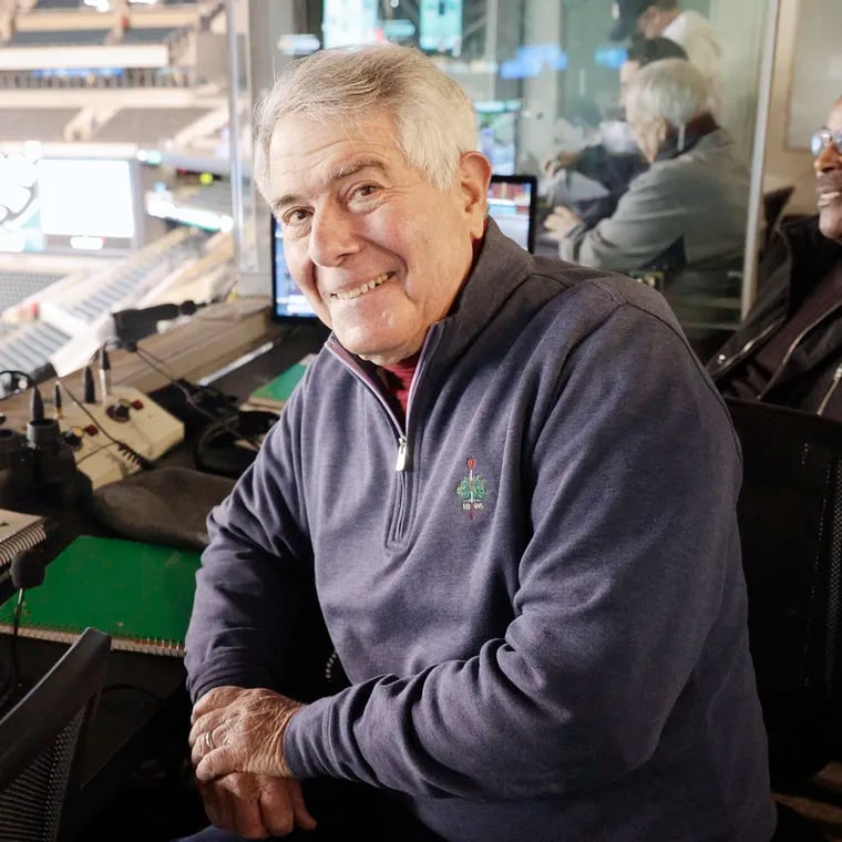 Beloved Eagles radio announcer Merrill Reese, sitting in the booth at Lincoln Financial Field alongside his longtime broadcast partner, Mike Quick.