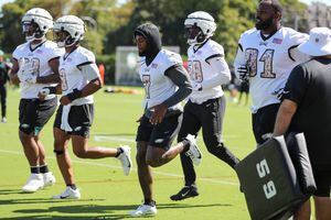 Philadelphia, PA, USA. 30th July, 2022. Philadelphia Eagles Linebacker HAASON  REDDICK (7) carries his helmet with padded shell called a Guardian Cap  during training camp activities on Saturday, July 30, 2022, at