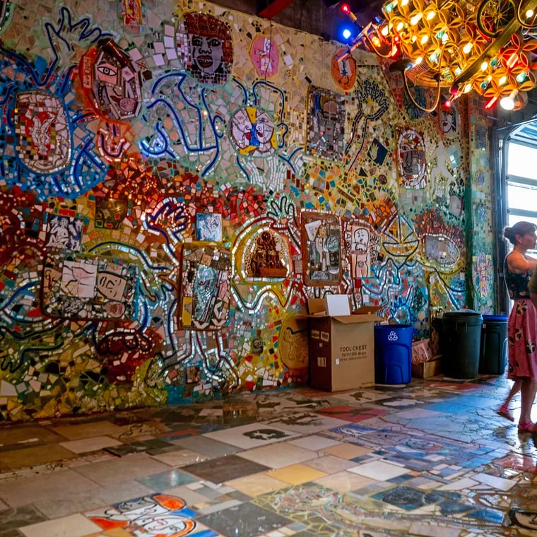 Philadelphia’s Magic Gardens Executive Director Emily Smith and Preservation & Facilities Manager Stacey Holder (right) on the first floor of the former studio of mosaic artist Isaiah Zagar, now owned by PMG.