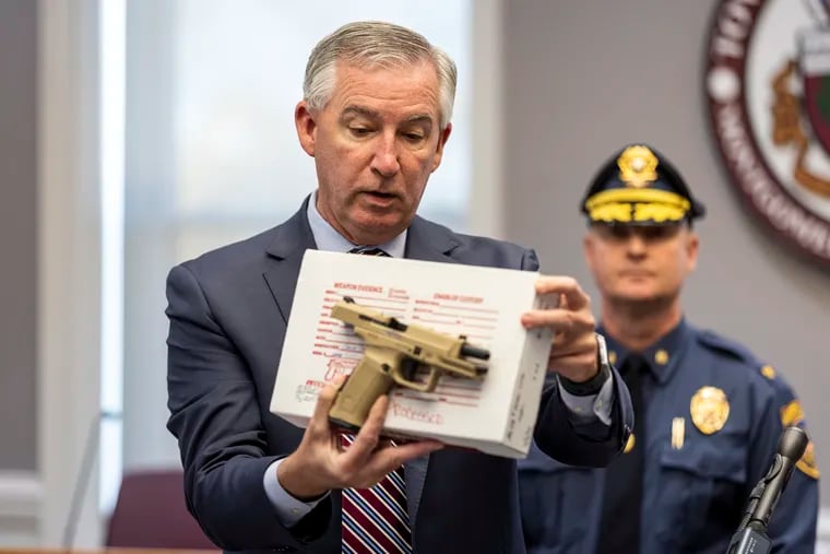 Montgomery County District Attorney Kevin R. Steele at an earlier news conference, showing a firearm where the serial number was removed.