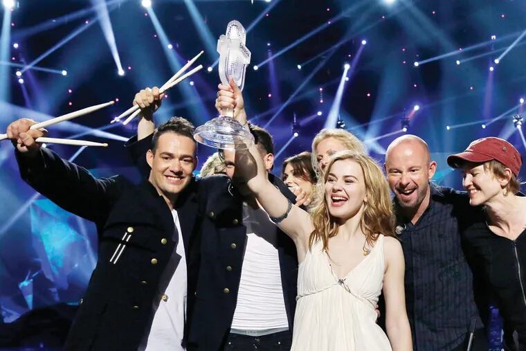 Winner of the 2013 Eurovision Song Contest Emmelie de Forest of Denmark who sang "Only Teardrops," celebrates with the trophy after the final at the Malmo Arena in Malmo, Sweden, Saturday, May 18, 2013. The contest is run by European television broadcasters with the event being held in Sweden as they won the competition in 2012. (AP Photo/Alastair Grant)