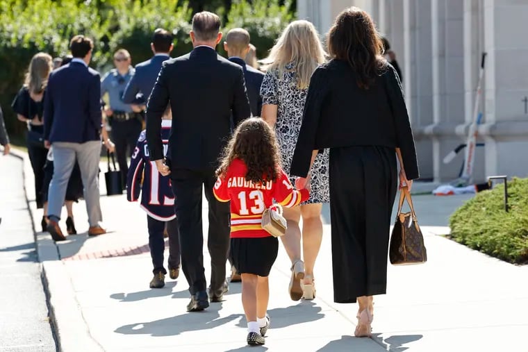 A young attendee wears a Johnny Gaudreau jersey as they arrive for funeral services for Johnny and Matthew Gaudreau at St. Mary Magdalen Church in Media.