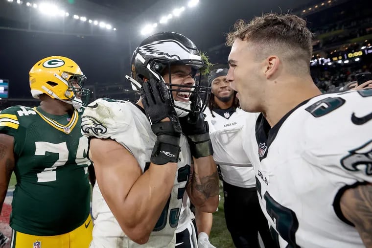 Eagles linebackers Zack Baun (left) and Ben VanSumeren celebrate after the season opener against the Green Bay Packers in Brazil on Sept. 6.