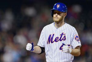 Philadelphia Phillies' Didi Gregorius, left, and Zack Wheeler put