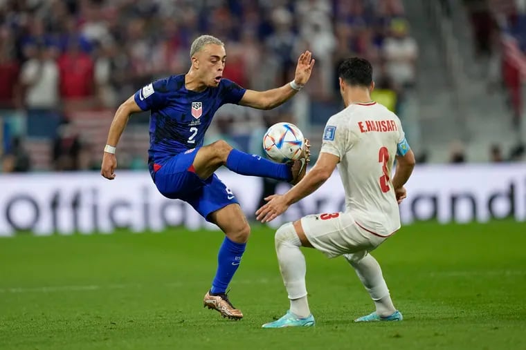 Sergiño Dest (left) playing for the U.S. men's soccer team at the World Cup last fall.