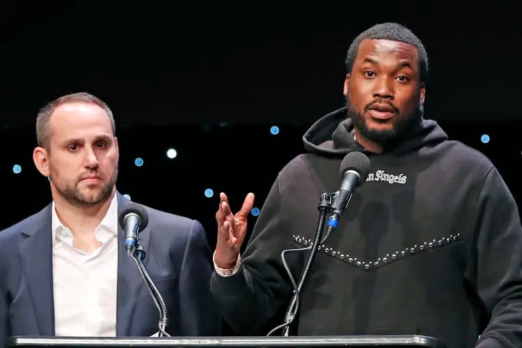 Recording artist Meek Mill, right, speaks about his incarceration along with Philadelphia 76ers co-owner and Fanatics executive chairman Michael Rubin.