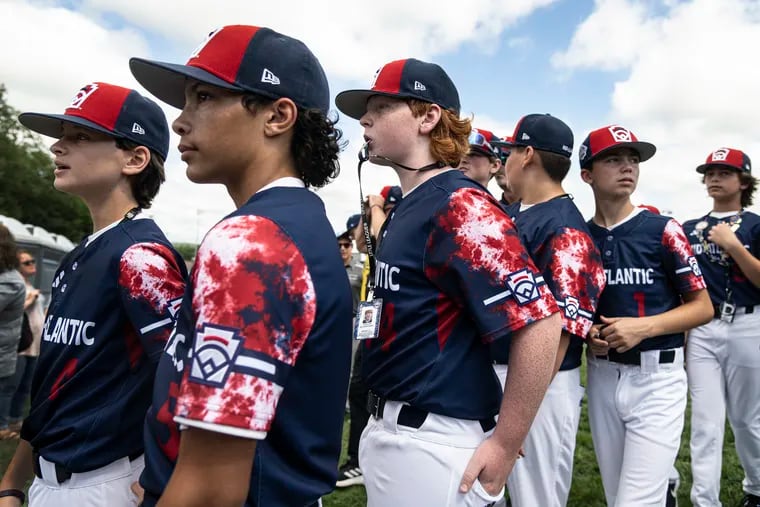 Media Little League player Christian Nuñez (second from left) looks on with teammates Wednesday during the Little League  World Series opening ceremonies.