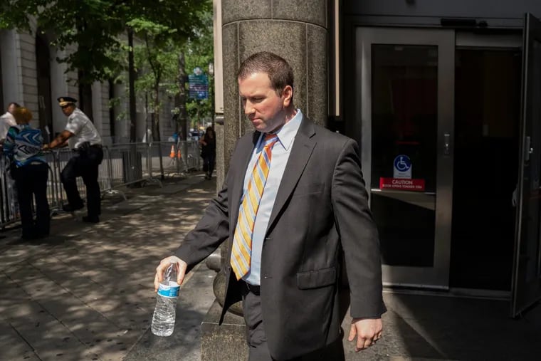 In a file photo, former Philadelphia Police Officer Ryan Pownall exits the Stout Center for Criminal Justice, in Center City Philadelphia, on Tuesday, Aug. 6, 2019.