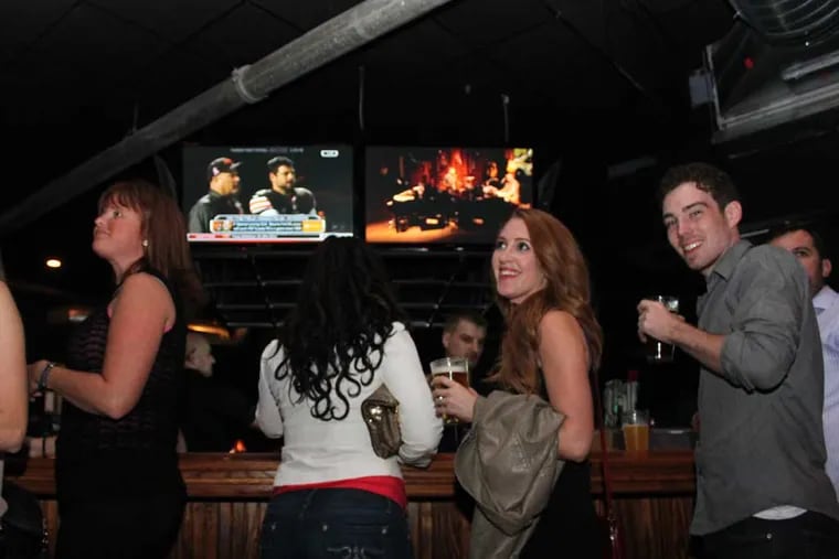 Patrons enjoy a night out at Howl at the Moon in Center City, Philadelphia in 2013. Last night, the live music venue and bar abruptly closed.