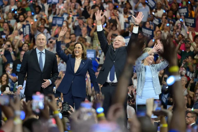 Democratic presidential nominee Vice President Kamala Harris and second gentleman Doug Emhoff along with her running mate Minnesota Gov. Tim Walz and his wife Gwen Walz waved at supporters at a rally in Philadelphia, Tuesday, Aug. 6, 2024.