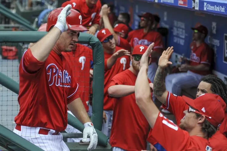 Phillies first baseman Tommy Joseph (left) gets congratulated by coaches and teammates after hitting a solo homerun in the 5th inning in the game against the St. Louis Cardinals June 22, 2017 at Citizens Bank Park. Joseph was the hitting star of the game driving in 4 runs as the Phillies won 5-1. CLEM MURRAY / Staff Photographer