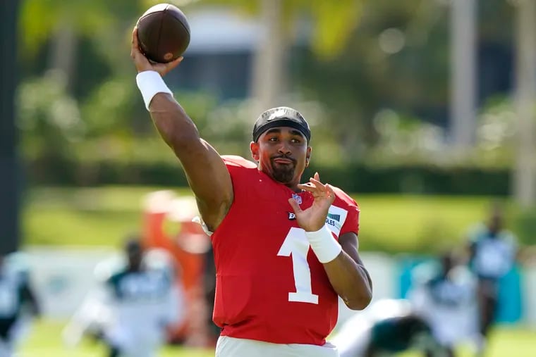 Philadelphia Eagles quarterback Jalen Hurts (1) takes part in drills at the Miami Dolphins' NFL football team's practice facility on Thursday in Miami Gardens, Fla.