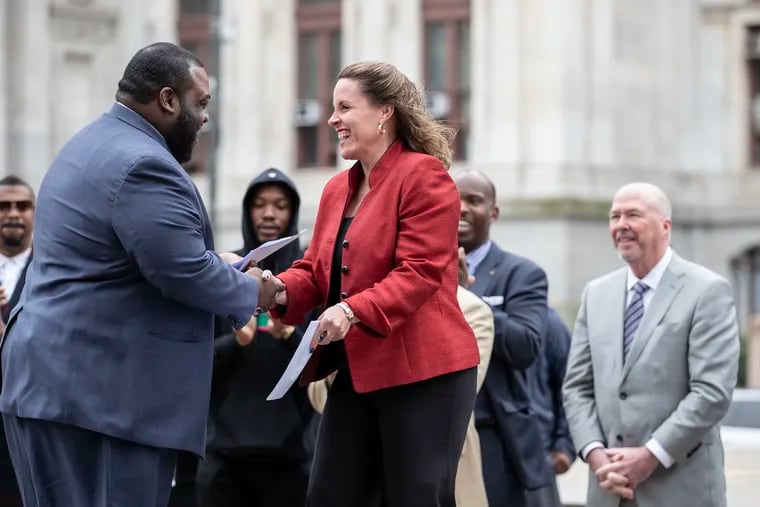 State Rep. Jordan Harris (D-Phila., left) greets state Rep. Sheryl Delozier (R-Cumberland). The two co-sponsored the Clean Slate law.