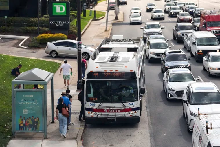 People board a SEPTA bus on City Avenue. On Thursday, the SEPTA board approved Bus Revolution, the first route overhaul in the transit agency's 60-year history.