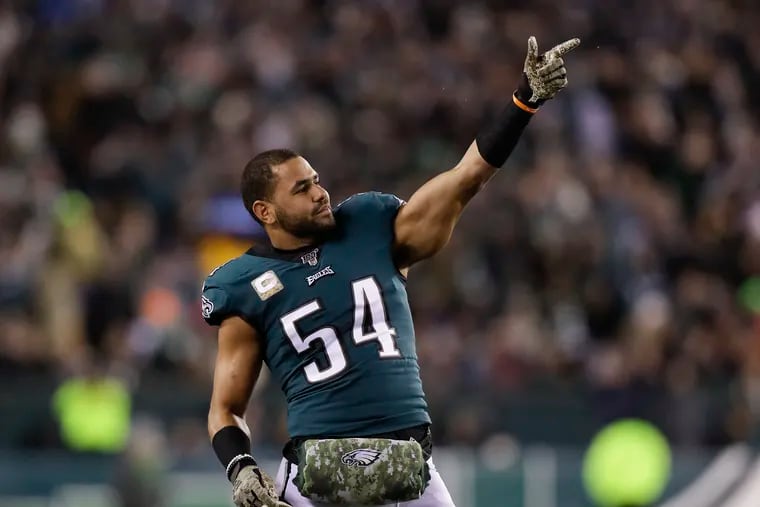 Eagles linebacker Kamu Grugier-Hill points after a video review showed the Eagles scored a second-quarter touchdown against the New England Patriots last month.