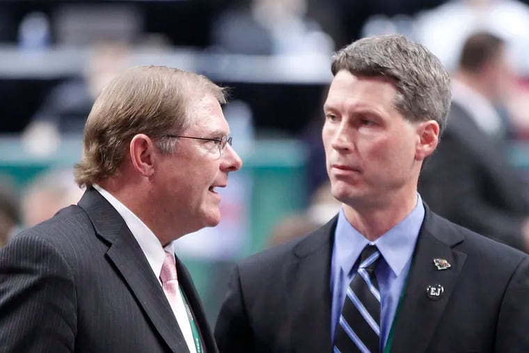 Wild general manager Chuck Fletcher (right) talking to team owner Craig Leipold, at the NHL draft in 2011.