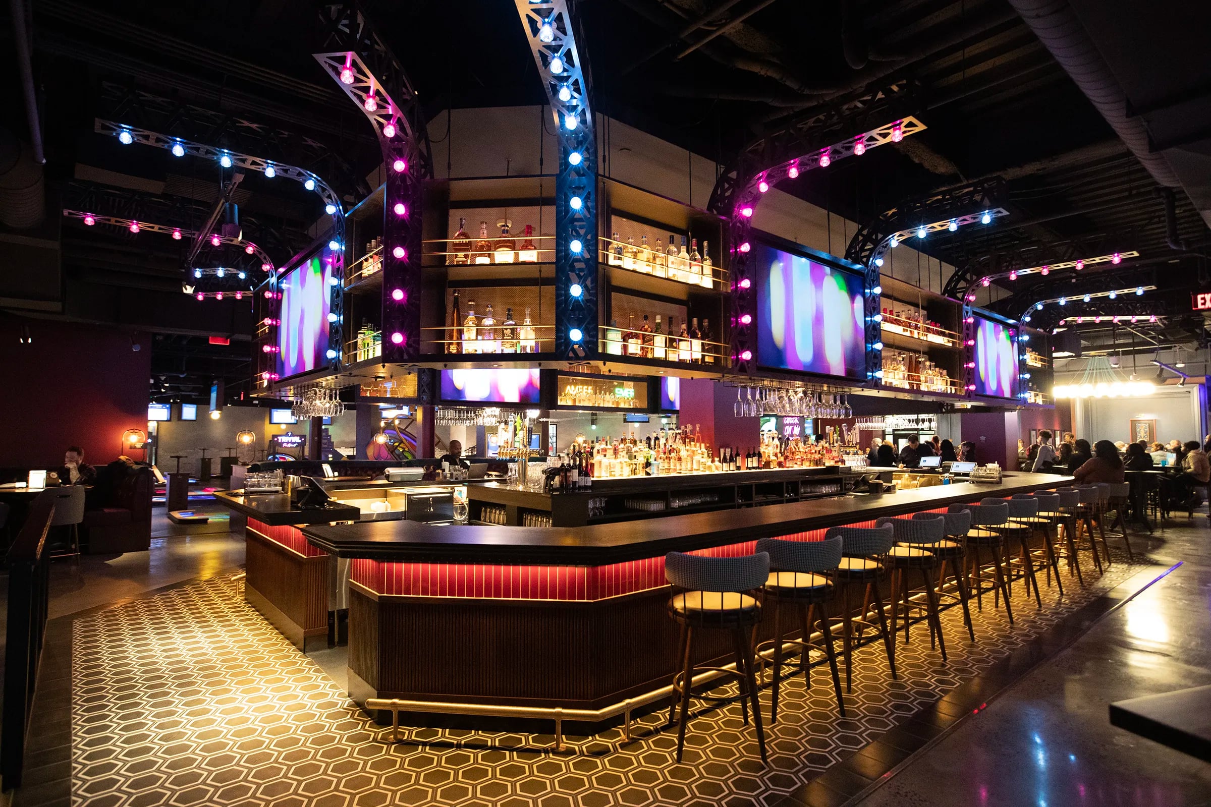 Puttshack is a new "upscale tech-infused mini-golf experience" opening in Liberty Place in Center City Saturday It's the second of indoor mini-golf bar-restaurant to open in a two-mile radius since 2021. The bar area is shown during a preview evening on Feb. 20, 2024.