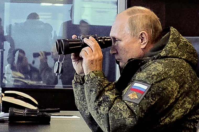 Russian President Vladimir Putin watches the Vostok 2022 military exercise in far eastern Russia, outside Vladivostok, on Tuesday, Sept. 6, 2022. The weeklong exercise that began Thursday is intended to showcase growing defense ties between Russia and China and also demonstrate that Moscow has enough troops and equipment to conduct the massive drills even as its troops are engaged in military action in Ukraine.