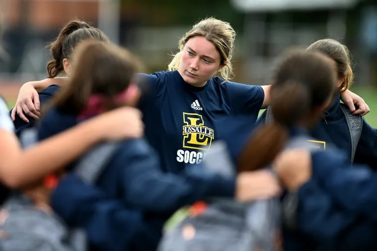 La Salle senior Alyssa Van Heurck with her teammates following their loss to Virginia Commonwealth University (VCU) Oct. 17, 2021.