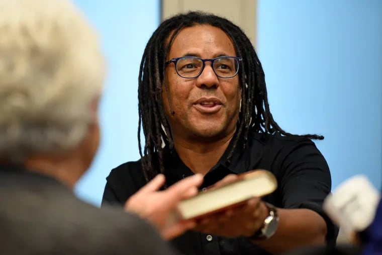 Colson Whitehead autographs copies of "The Underground Railroad" during a 2018 event in Ardmore.