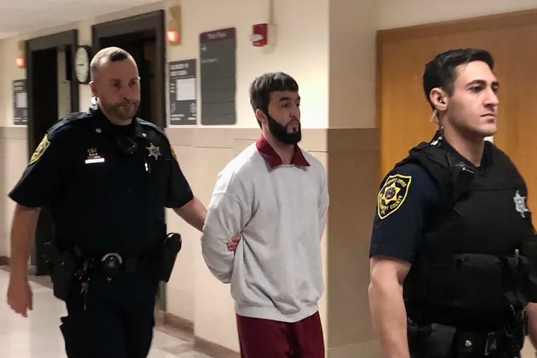 Daniel Rohloff is escorted into a courtroom in the Montgomery County Courthouse. He was convicted Wednesday of attempted murder for causing what prosecutors called catastrophic injuries to his newborn son.