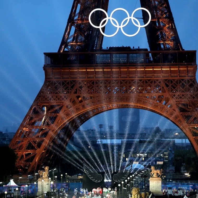 Lights shine under the Eiffel Tower, in Paris during the opening ceremony of the 2024 Summer Olympics.