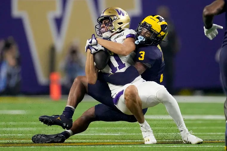 Michigan' Keon Sabb had six tackles on Monday, including this one on Washington wide receiver Jalen McMillan.