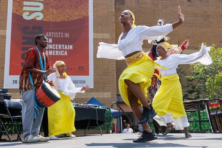 Members of the Camara Arts & Tyehimba perform at the start of a Juneteenth celebration last year at the African American Museum in Center City.