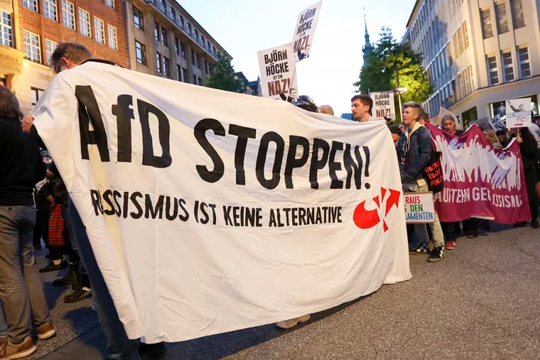 Participants in a demonstration against the right hold a banner with the slogan "Stop AfD! Racism is not an alternative" in Hamburg.