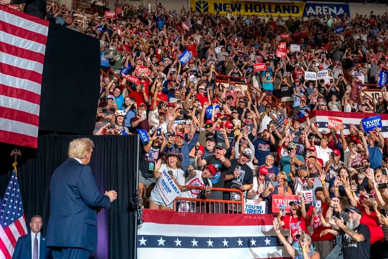 Former President Donald Trump greets supporters as he arrives onstage at the Pennsylvania Farm Show Complex in Harrisburg, Wednesday, July 31, 2024.