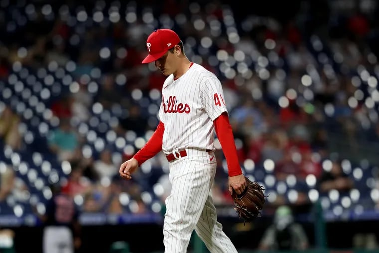 Spencer Howard of the Phillies walks off the field after being pulled from the game in the fourth inning against the Red Sox.