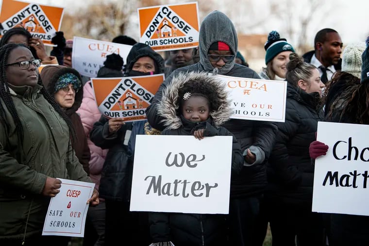 Khrystine Hudnell (center) and Jordyn Jones (front center) join a rally outside Chester High School in support of district schools the night before a December 2019 court hearing on a petition to convert district schools to charters.