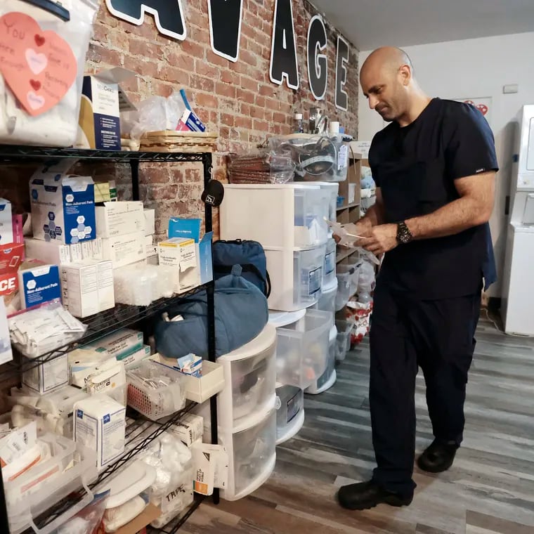 Jamaal Shaban puts medical supplies away after a wound training session at Savage Sisters, an addiction outreach nonprofit based in Philadelphia's Kensington neighborhood.