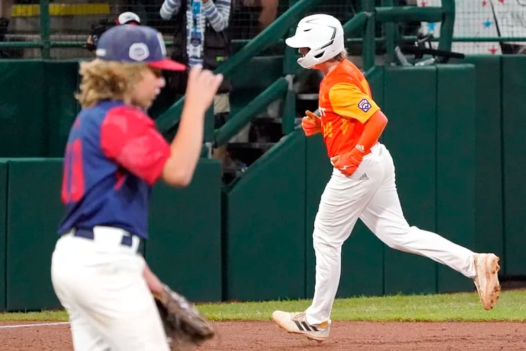 Hollidaysburg, Pa.'s Chase Link rounds third base on his two run home run off of Hollidaysburg, Pa. pitcher Chase Link, left, during the sixth inning of a baseball game at the Little League World Series tournament in South Williamsport, Pa., Wednesday, Aug. 24, 2022. Texas won 8-4.