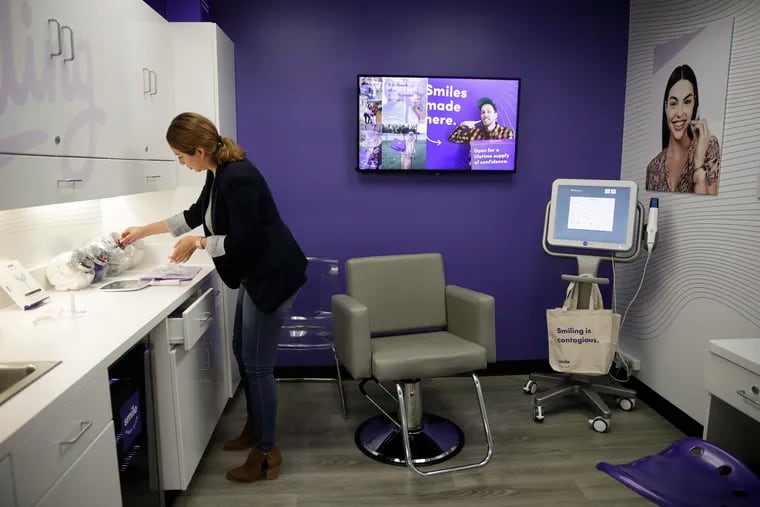A dental assistant works in SmileDirectClub's SmileShop located inside a CVS store in California in 2019.