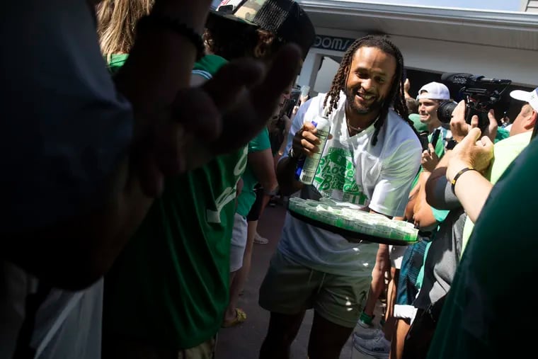 Avonte Maddox carries Jell-O shots through the crowd during the Jason Kelce Beach Bash in support of the Eagles Autism Foundation at Ocean Drive in Sea Isle City, NJ on Wednesday, June 26, 2024. Kelce and other NFL players bartend for charity at the annual event.