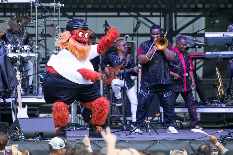 Flyers mascot, Gritty, dances with Kool and the Gang during their performance at the Hoagie Nation festival, starring Hall & Oates, Squeeze, and Kool & the Gang on Aug. 7, 2021.